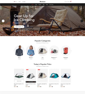 Startseite eines Outdoor‑Ausrüstungsshops mit großem Hero‑Bild eines Campingplatzes (Zelt, Klappstuhl, Feuerstelle) und der Überschrift "Gear Up for Ice Climbing", darunter runde Symbole für beliebte Kategorien (Jacken, Damen, Zelte, Zubehör, Rucksäcke) und eine Rasteransicht mit heutigen Angeboten für Zelte.