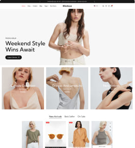 E‑Commerce‑Mode‑Homepage mit zentralem Hero‑Foto einer brünetten Frau in beigem Croptop, die Hände am Oberbauch hält; darunter drei kleinere Modelaufnahmen (blonde Frau in hellem Top, Rückenansicht eines weißen Kleids mit tiefer Rückenaussparung, Frau im schwarzen ärmellosen Top) und ein Produktraster mit Oberteilen und Accessoires.