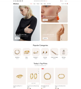 Webshop-Startseite für Schmuck mit Navigation und Suchleiste oben, großen Hero‑Bildern zweier Models, darunter Symbole für beliebte Kategorien und ein Raster mit empfohlenen Ohrringen, Ringen und Armbändern auf hellem Hintergrund.